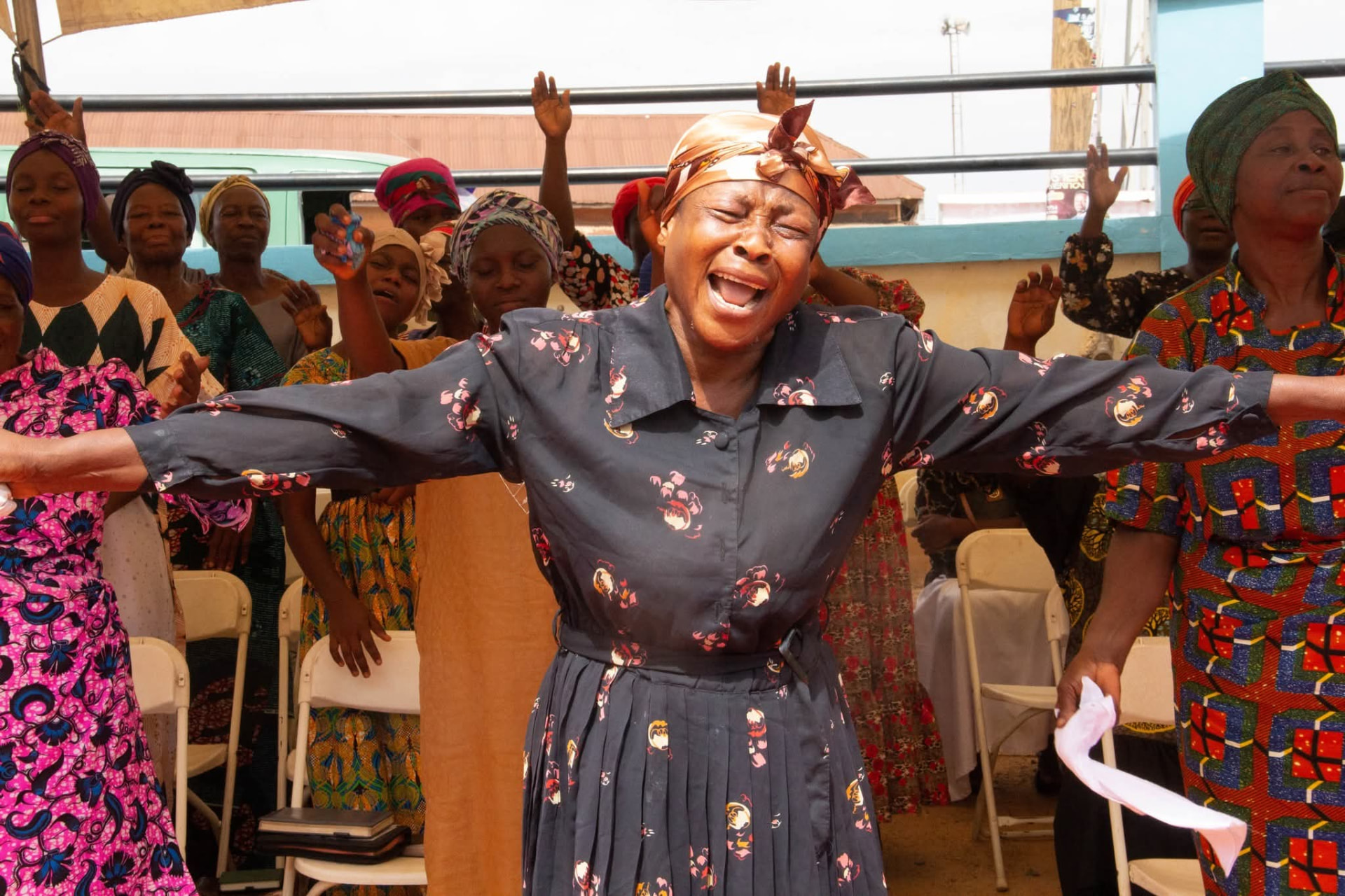 Congregation worshipping with hands raised